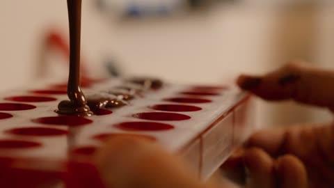 Shaping Melted Chocolates Using A Tray Mold