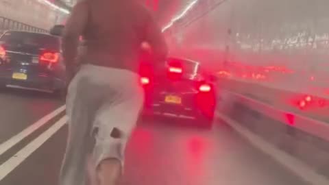 Bum Runs Through Holland Tunnel Traffic Jam! 😂 #StreetComedy #NYC #FunnyShorts #LOL