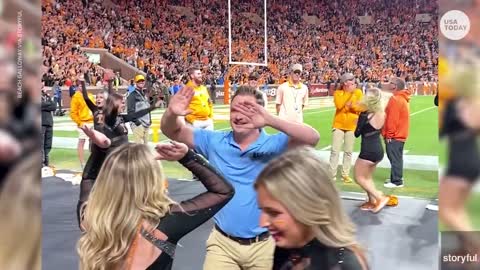 Busted! Fake security guard dances during Tennessee football game | USA TODAY