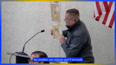 Concerned Parent Holds Up Gender Queer Poster at School Board Meeting