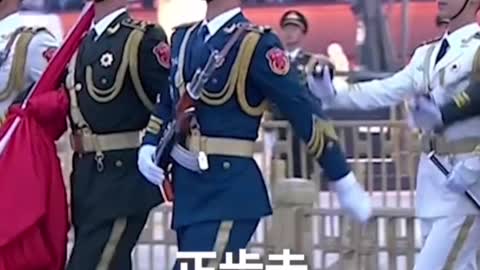 Raising the national flag at Tiananmen Square