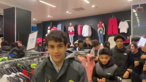 Mizzy leads a crowd of youths through Primark, trashing it as they go