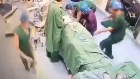 Triple jabbed Australian surgeon stroking out mid-surgery.