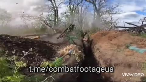 Ukrainian soldiers fire at RU positions from turret with two twin RPGs.