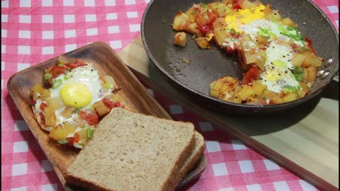 Try this 'EGG, POTATO AND TOMATO' breakfast recipe.