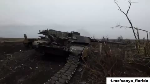 A Russian soldier inspects a shot-down Abrams tank of the AFU in Berdychi.