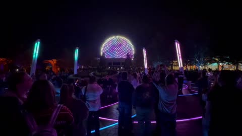 World Celebration interacts with Spaceship Earth’s lighting shows