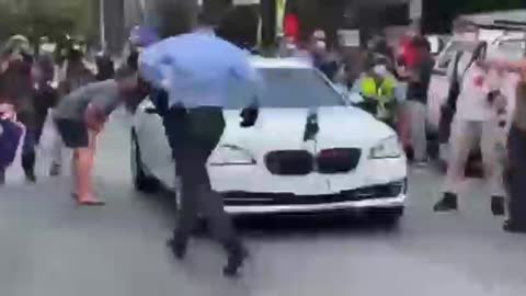 Scumo getting escorted from the National Press Club building in Canberra