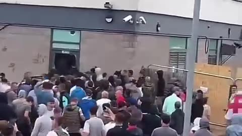 Protesters storm a hotel in Rotherham, UK,