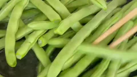 The cook greased the pan before frying the vegetables.