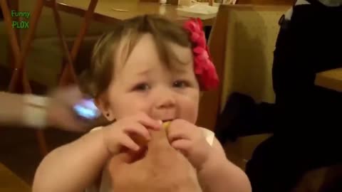 baby trying lemon for the first time