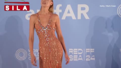 Stella Maxwell in a jewel-encrusted peach gown at amfAR Gala