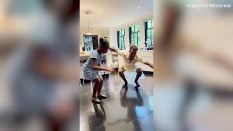 Madonna's son dances with his sister wearing singer's dress