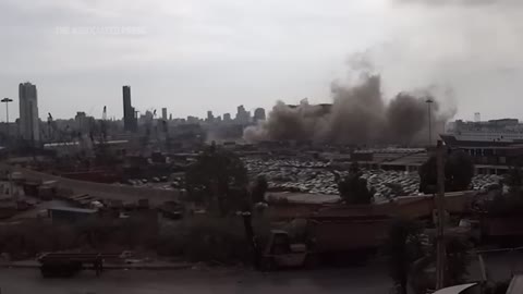 Beirut's grain silos partly collapses after fire.