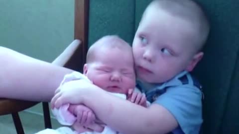 big brother holding babysister_batch