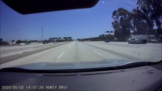 Car Swerves Straight Into the Side of a Dump Truck