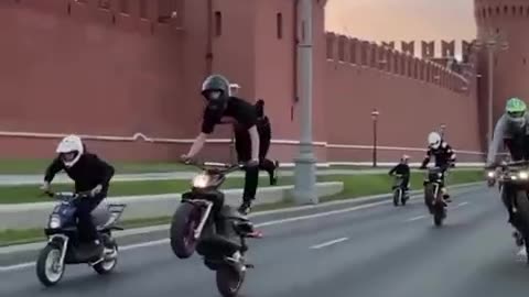 Crazy kids doing motorcycle stunts