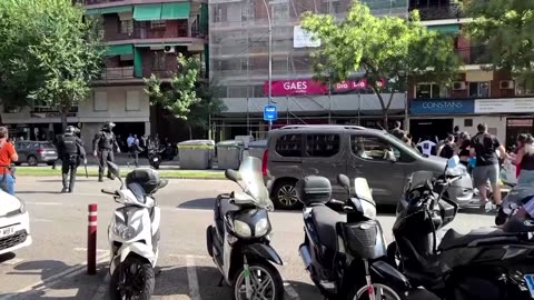 Barcelona police chase protesters outside real estate fair