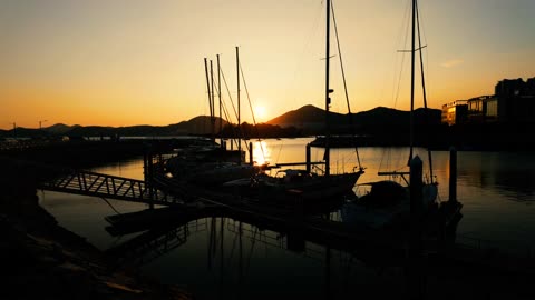 Silhouettes of Yachts at Sunset in Yeosu Marina