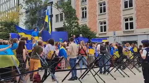 People gathered in front of the EU Council in support of granting candidate status to Ukraine