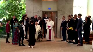 Pope Francis arrives to dancing children in Singapore