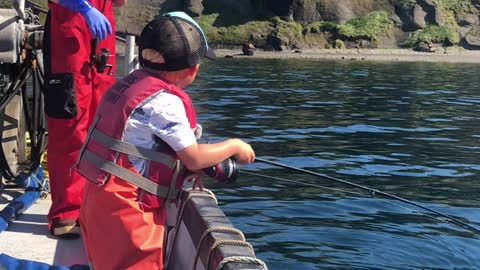 Excited Three-Year-Old Catches a Fish