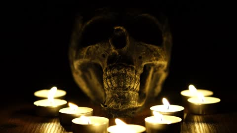 Skull with lighted tea candles