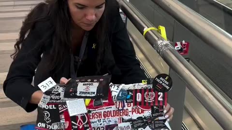 Removing the hostage tributes at Ben Gurion airport.