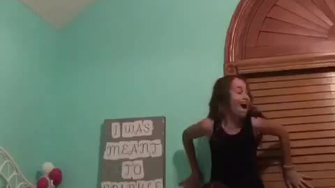 Girls try to do piggy back ride on bed fall into window