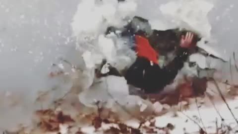 Guy red sled slide frozen lake