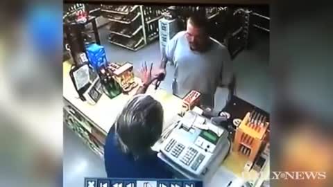 Robber pulls gun, liquor store clerk is faster- CRAZY