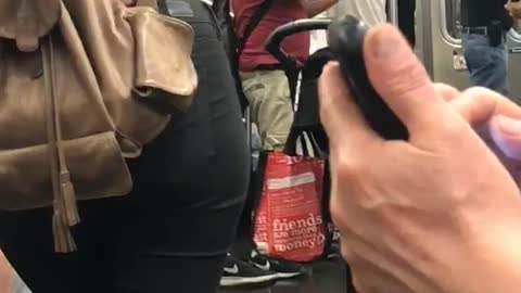 Guy red shirt playing violin subway