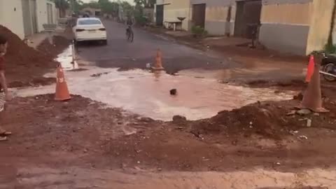 Boy Rides His Bike Into Giant Pothole