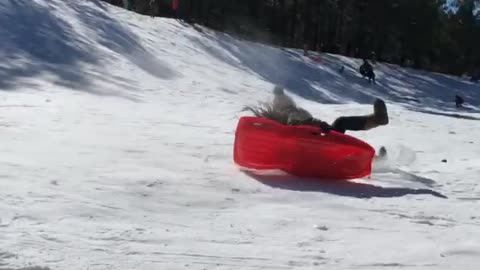 Woman Sledding Loses Control and Hits Ice Block