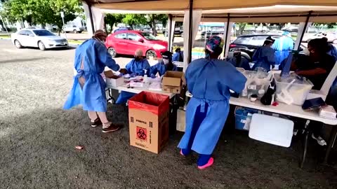 Snaking cars wait COVID tests in Puerto Rico