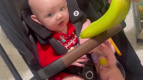 Adorable Baby's First Encounter with Bananas in a Superstore