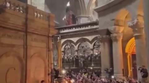 Fire coming out of Jesus's tomb on Orthodox Easter