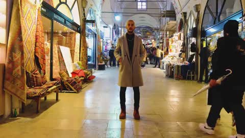 Wide Shot of Man Stood in Shopping Centre