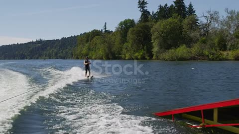 Water skier crashes off ski jump, slow motion