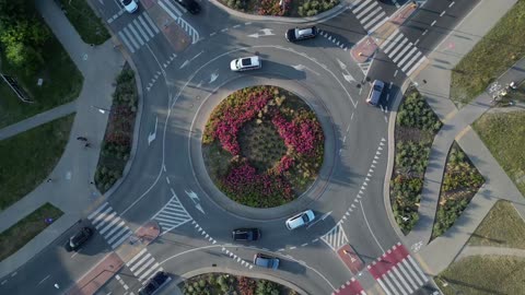 Top-down View of a Rounda bout with flowers in in the centre