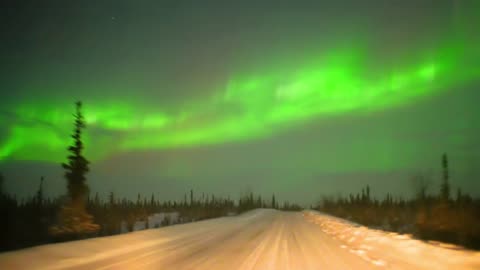 Driving Under a Bright Aurora in Coldfoot, Alaska