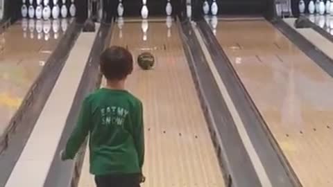 Little Boy Knocks Down Bowling Pins With Single Strike