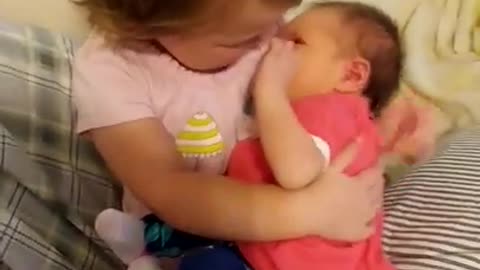 Big sister yells, " Get her a binky."