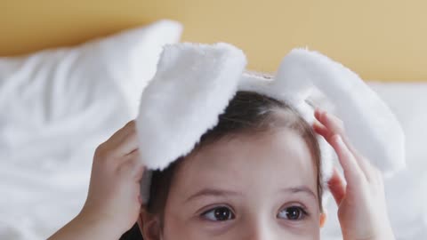 A Cute Girl Wearing An Easter Bunny Headband