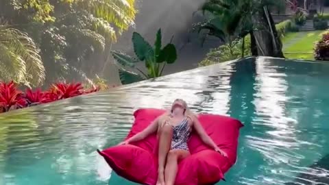 RELAXING ON A WATER BED AT BALI IN INDONESIA