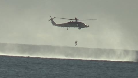 Why Is That Helicopter Hoovering Over The Ocean? Surprise If You Wait..