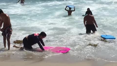 Boogie boarders at Waikiki Beach, Hawaii