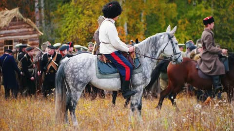 a man standing on the horse on the field