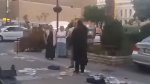 Orthodox monk in Athens destroys heretical Jehovah’s Witness book cart