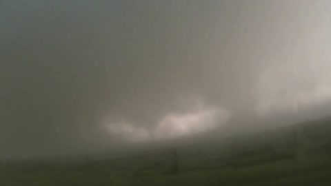 Take a close-up shot of a large tornado